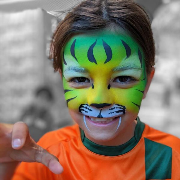 Aussie tiger face painting in TAG LIGHT GREEEN and TAG GREEN and TAG YELLOW face paints and using Flora brush