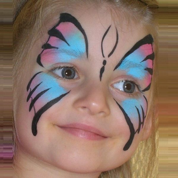 Butterfly face painting using TAG PINK and TAG LIGHT BLUE face paints