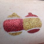 Christmas Baubles glitter tattoo in TAG Holographic Gold and TAG Ruby Red glitter