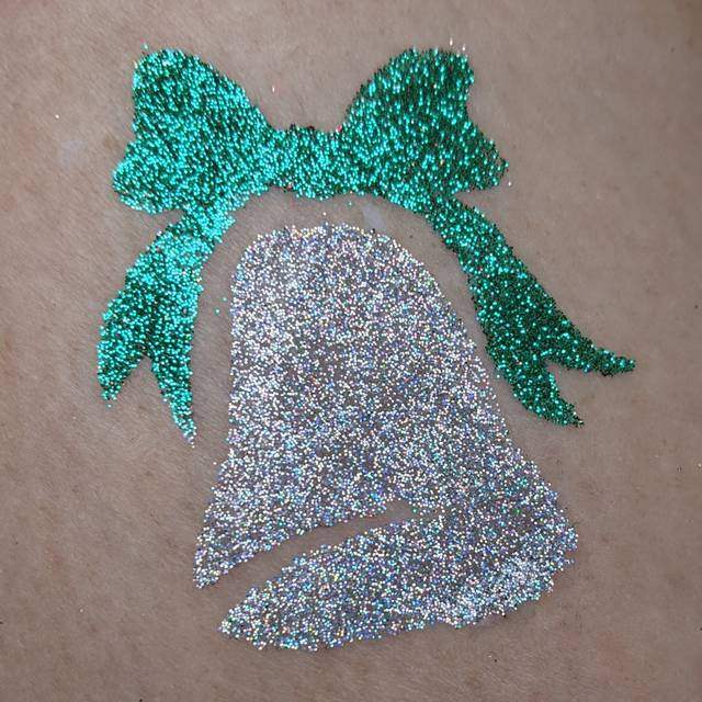 Christmas Bell glitter tattoo in TAG Holographic Silver glitter and TAG Emerald Green glitter