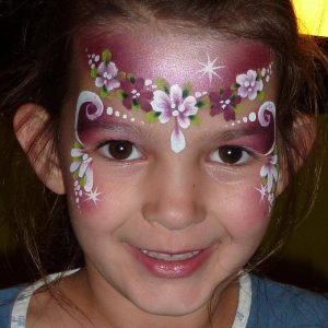 Flower face painting using TAG Pearl WINE and TAG BERRY WINE face paint