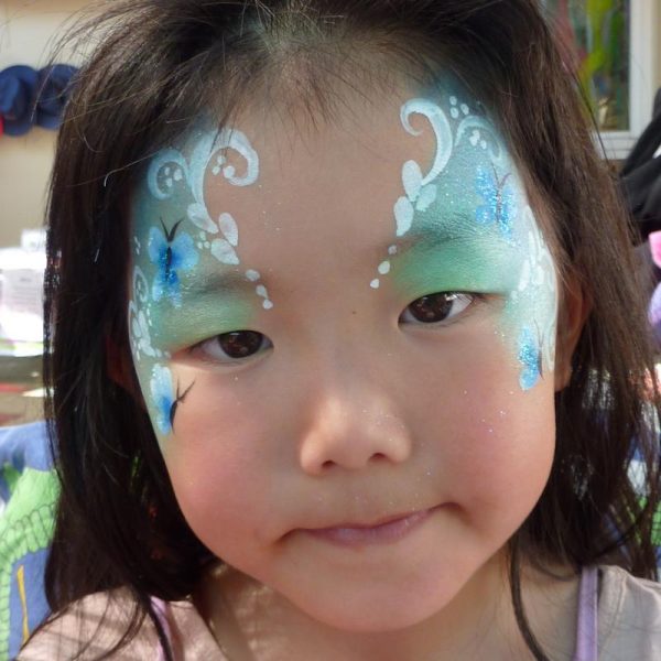 Flutterfly Fairy face painting using TAG Pearl TEAL and TAG Pearl SKY BLUE face paints
