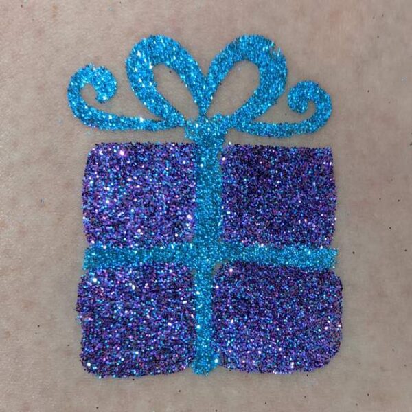 Gift glitter tattoo in TAG Electric Blue glitter and ABA Fiesta Purple glitter WITH EXTRA RIBBON ADDED AFTER REMOVING STENCIL