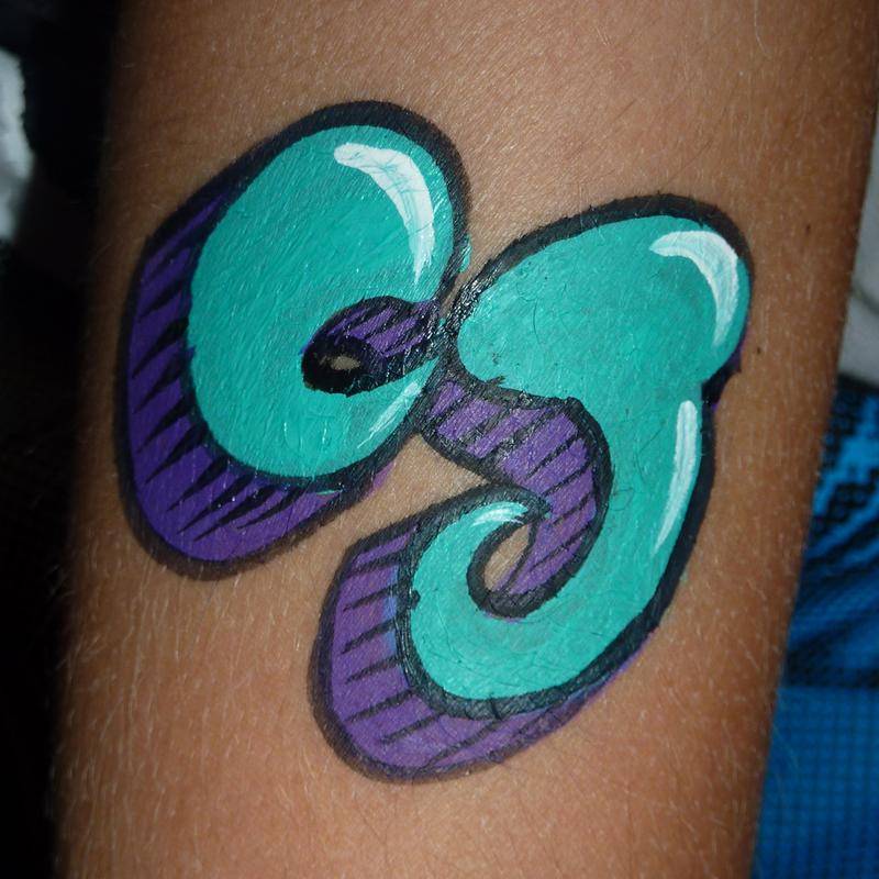 Graffiti arm painting using TAG TEAL and TAG PURPLE face paints