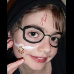 Harry Potter Snitch face painting using spouncer