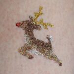 Leaping Reindeer glitter tattoo in TAG Bronze, Holographic Dark Gold, Holographic Gold and ABA Pearl White