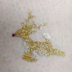 Leaping Reindeer glitter tattoo in TAG Holographic Gold and ABA Pearl White
