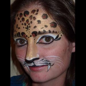 Leopard face painting design in TAG Pearl GOLD face paint