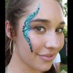 One-stroke face painting using TAG PEACOCK One-stroke with gold glitter gel dots