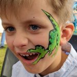 T.rex dinosaur face painting using BAM1005 scale stencil