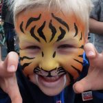 Tiger face painting using TAG ORANGE and TAG GOLDEN ORANGE face paint