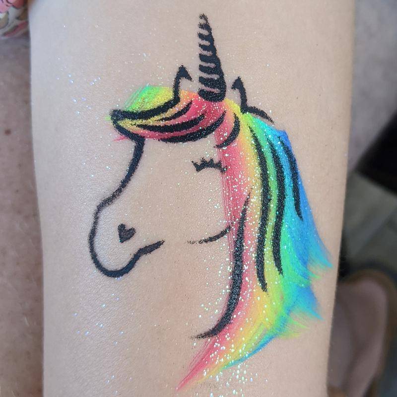 Unicorn face painting stencil painted with Face Paint World's RAINBOW LORIKEET one-stroke